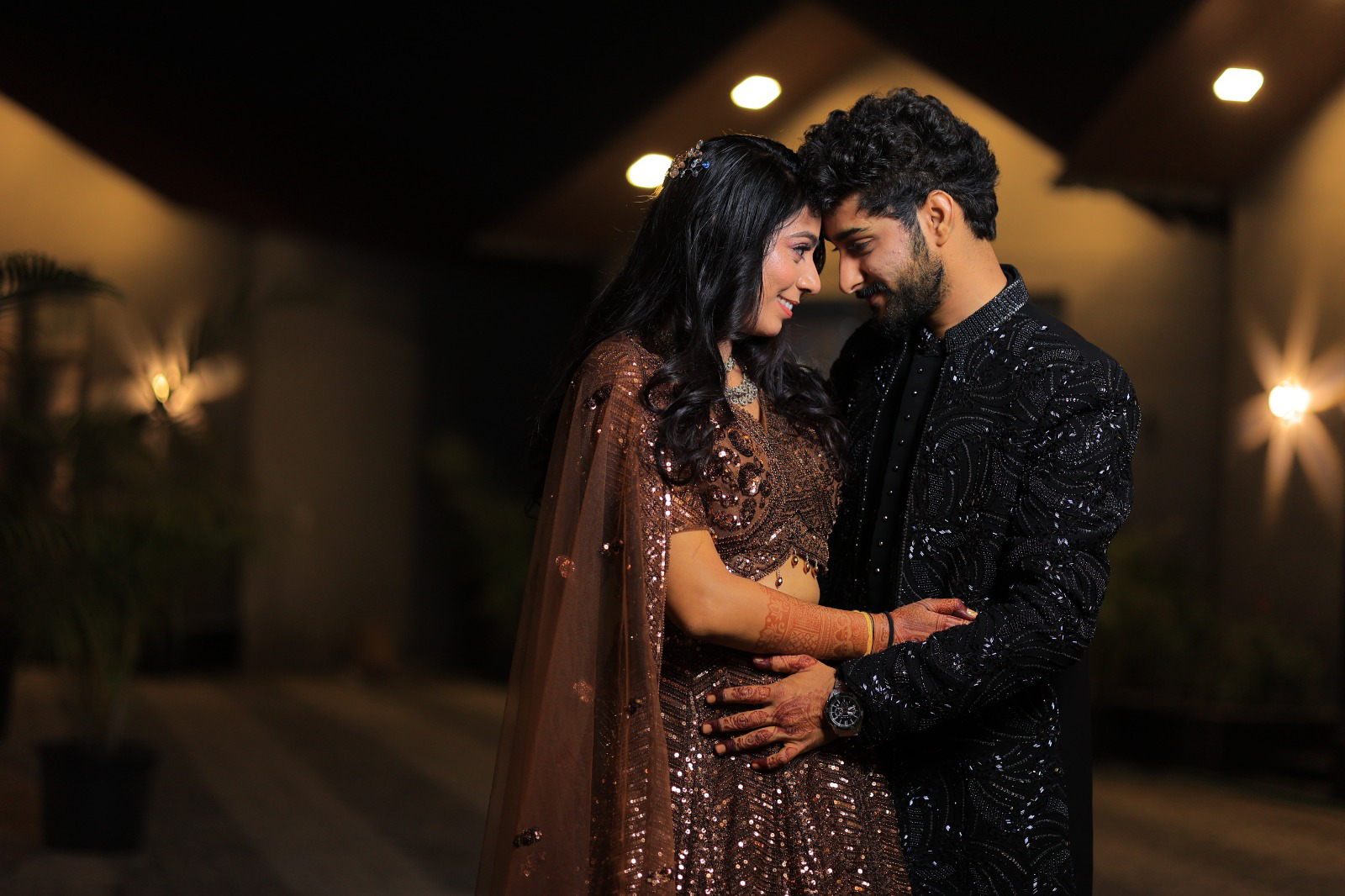 Couple embracing at night in cinematic light