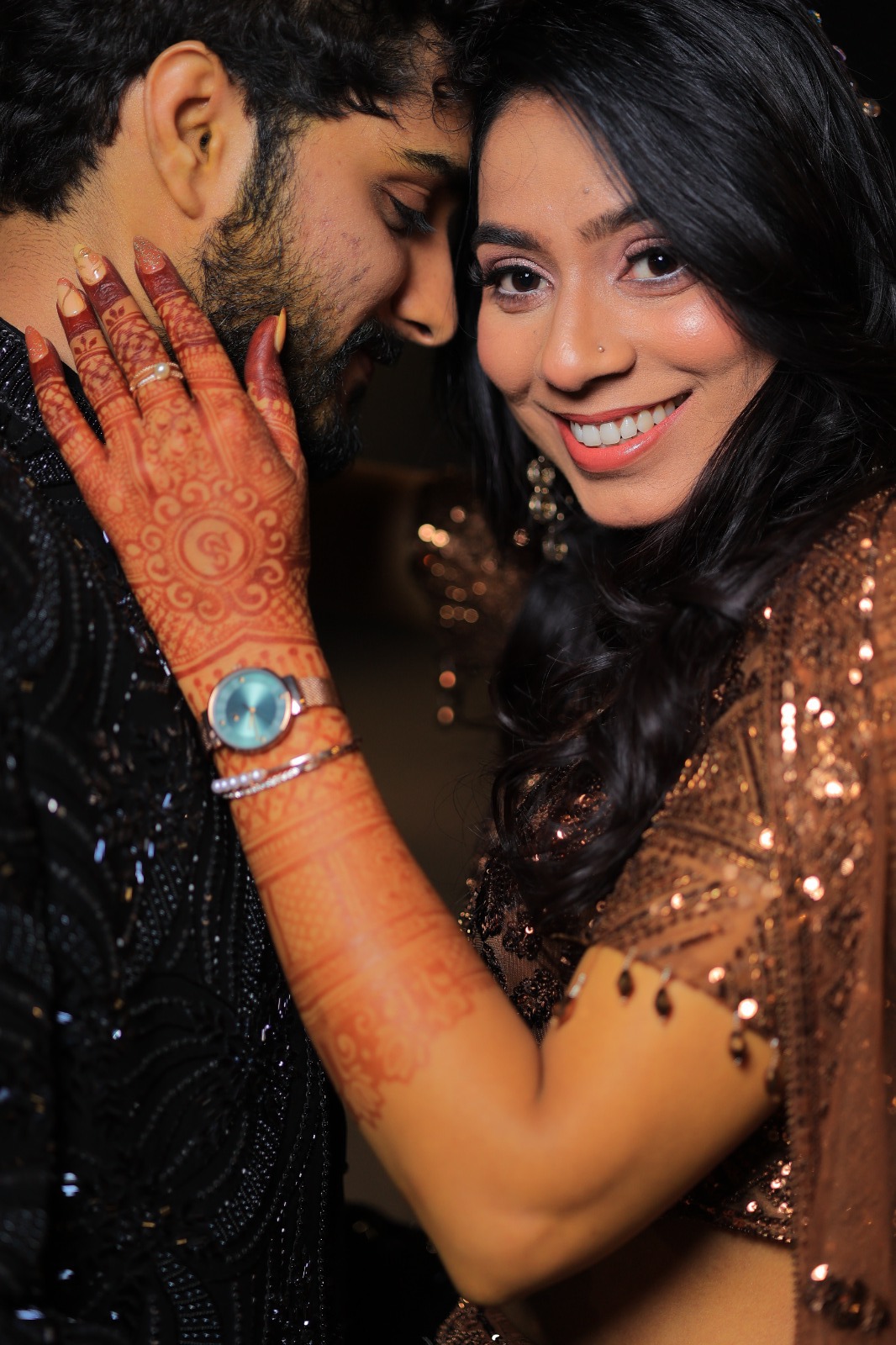 Henna-adorned hands during mehndi ceremony
