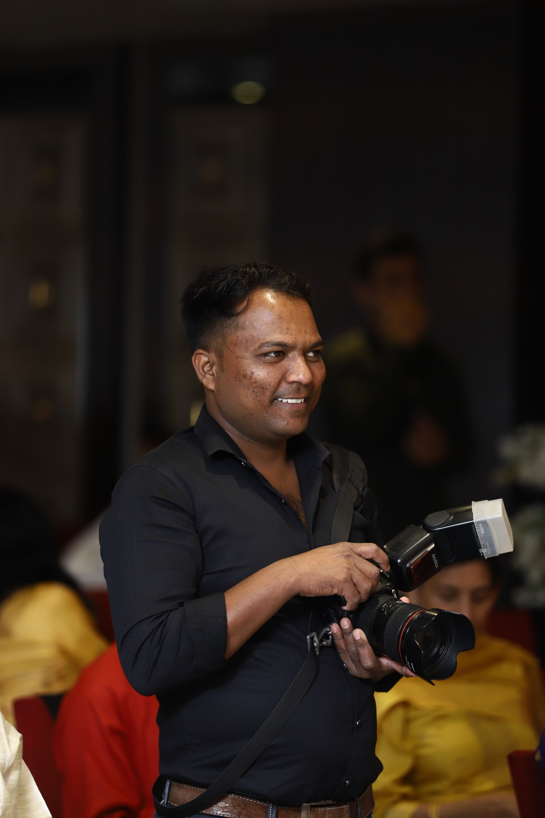 Manoj Badoliya editing wedding photos at the Family Photographer studio in Indore